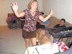 Me blowing out the candles on my birthday cake at my surprise party.