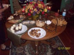 the spread at my party, mini pumpkin tarts with cream cheese icing, chocolate covered cream puffs, cheese straws, chocolate amaretto cake, assorted cookies, mini quiches, cheese ball & crakers....loads of goodies!