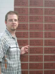 Eddie finding his brick at the Military Wall