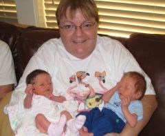 Holding my great niece and nephew