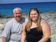 My dad and I sitting by the water in Grand Cayman....