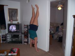 hand stands... with wall support