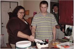 This is my husband and I a few days after we eloped. His sister throws us a party; this is when I was my biggest 360lbs.  I refused to be in a white dress at my size. Maybe someday I will get married in a "formal wedding."