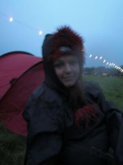 Rainy spell at a music festival. Check out that chubby face.