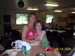 My friend Robin (in pink) and me at my daughter's graduation party.