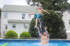 Daddy throwing Frankie in the pool