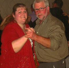 My Husband and I dancing at a Wedding