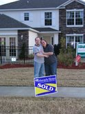 My Fiance Scott and I in front of our new house Feb 09'