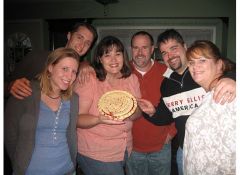 2 months before surgery.  Not quite at highest weight.  November 2007 I'm the one holding the pie, of course. LOL