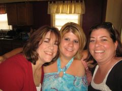 I'm in the middle to the right of me is my cousin and to the left of me is her Aunt headed to a concert July 2009.  61 lbs gone.