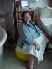 Me, pregnant and loving it!  On the birthing ball, hoping to use the waterbirthing tub to the left.  I didn't get to but still had a wonderful experience!

This was in 2001.