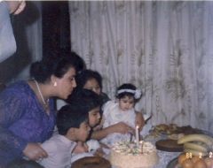Me in 1988, 1 year old, Im trying to blow the candle :))