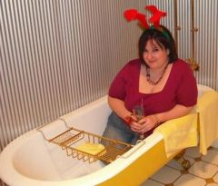 Drunk, obviously - why else be sitting in a bathtub with reindeer antlers?