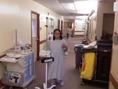 My first few steps after surgery.  Check out the blood spots on my gown - gross!