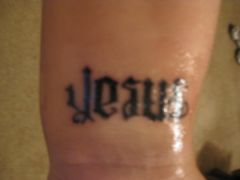 MY TATTOO: This is the same as the next pic. It's one tattoo, on my left inner wrist. It's called a flip script. Look one way and it says "jesus" flip  it and it says "freak". The freak faces me so most people just see Jesus unless I p