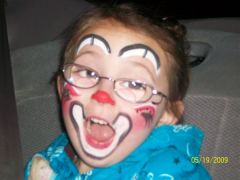 face painted like a clown at the circus