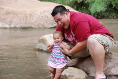 Letting my little girl walk in the river