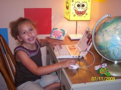 My girl with her "new desk" and "laptop" (Bratz)  This was my desk when I was a kid.  She thinks having her own desk is the best thing since sliced bread!
