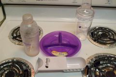 Protein shake jiggers from True Results.  My portion control scoop and my baby sons plate that I use for portion control.