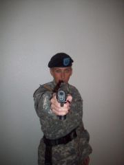 Me wearing my husband's uniform (my gun though)