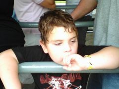 My son waiting to go on rides.