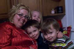 Yours Truly && 2 nephews && 1 niece.....I've always found this pic to be a fun one.....I weighted about what I do now (6-20-08) in this pic, 225ish........this pic was taken Dec 10, 2006~I then went to my highest weight of 260.