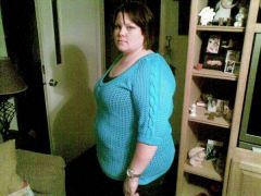 This is about 5 and 1/2 months out, 57 pounds down.  I wasn't smiling for some reason!  But I am happy! LOL!