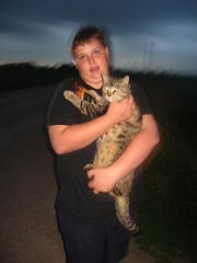My youngest, Chase, with our monster kitty, Figgy.