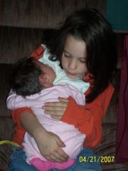 My daughter Eliana holding Zoe