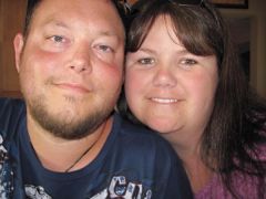 My husband and I. I don't feel like my face is as fat as it was. I'm down about 45-46 lbs here.