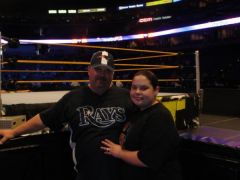 At a wrestling event 6 months after surgery, I got to wear a smaller size shirt!  This is my husband before surgery