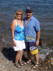 Me and my Hubby at boat races.  My first two piece swimsuit!  wore shorts with top, not ready for bottoms in public yet,need to tone legs!  LOL