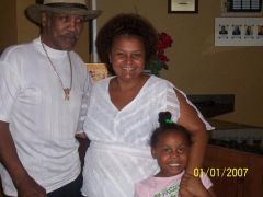 Me and retired boxer (forgot his name) I think Joe Frazier? and my daughter in 07/07 - camera date incorrect