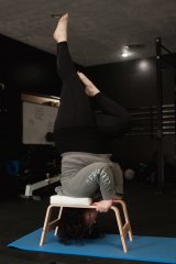Headstand using an inversion trainer